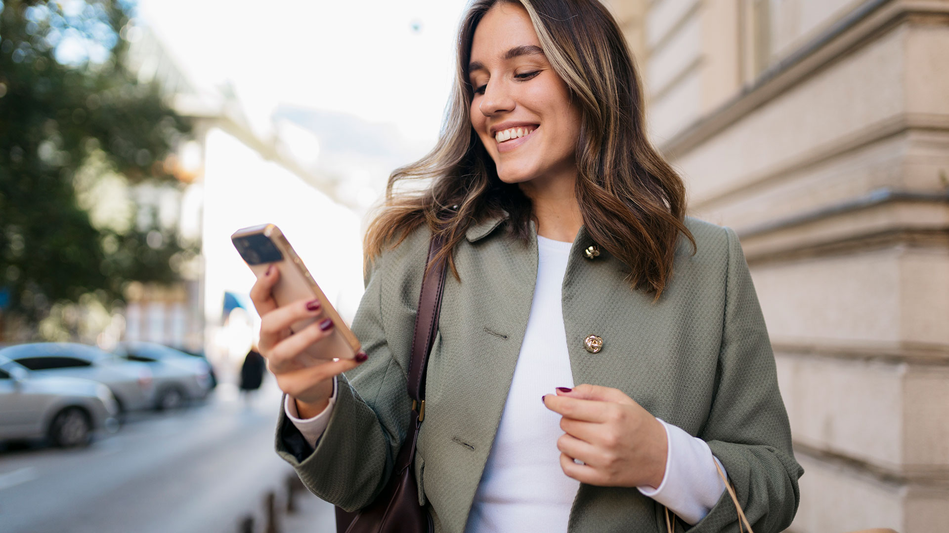 Resident using a smartphone while exploring the Centennial and Denver Tech Center area near The Wright apartments.